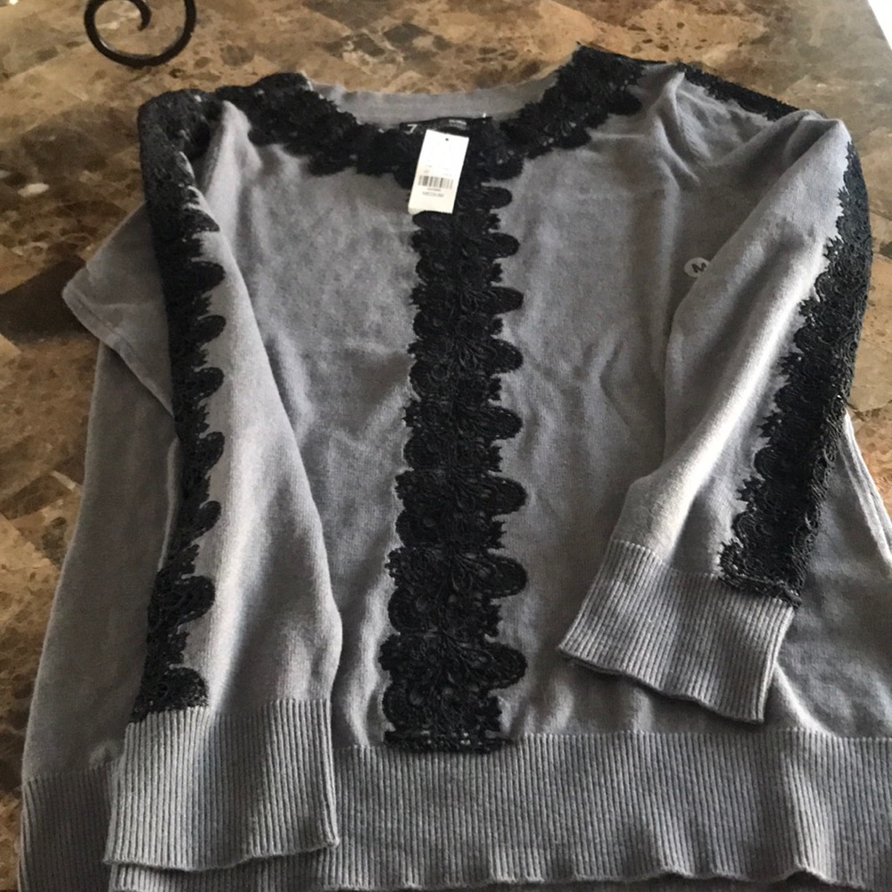 Never worn sweater with lace